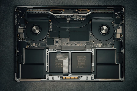 Photo of a partially disassembled laptop on a table